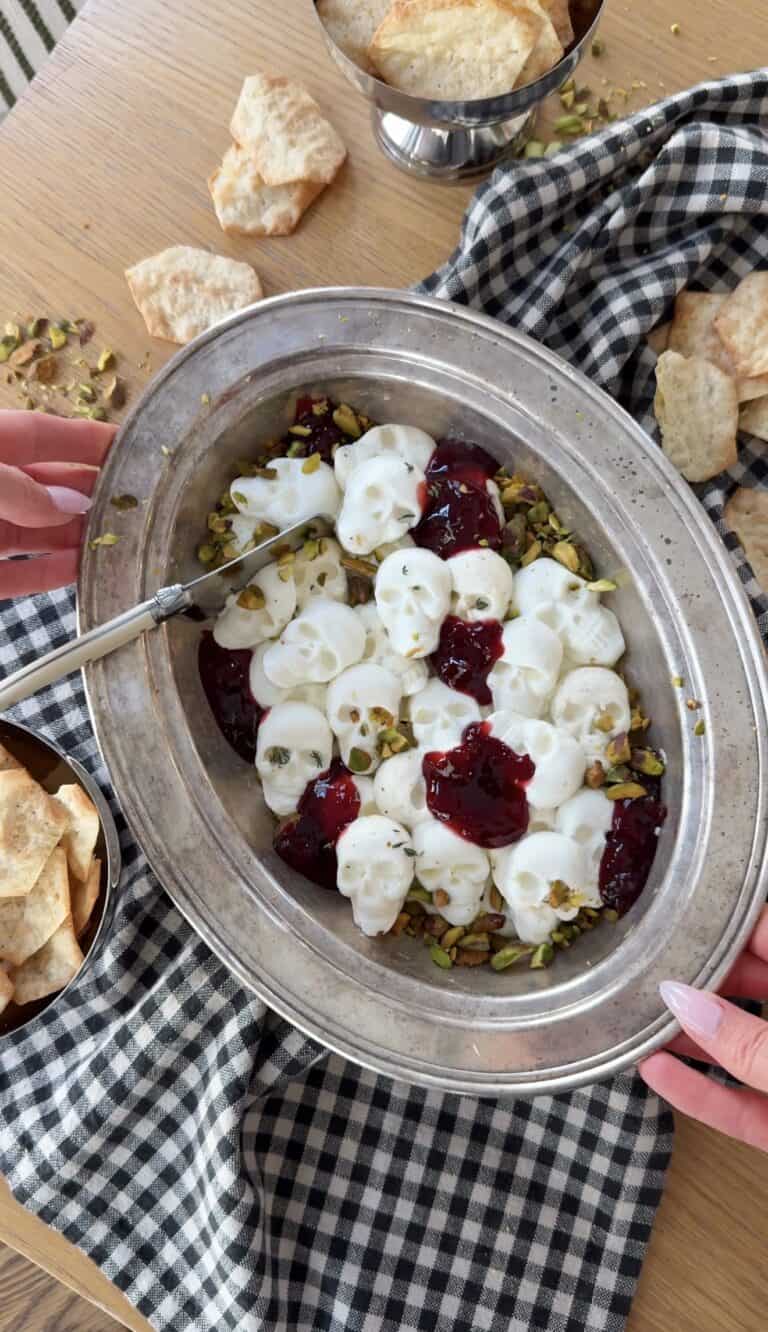 Creamy whipped ricotta and goat cheese with berry compote and pistachios.
