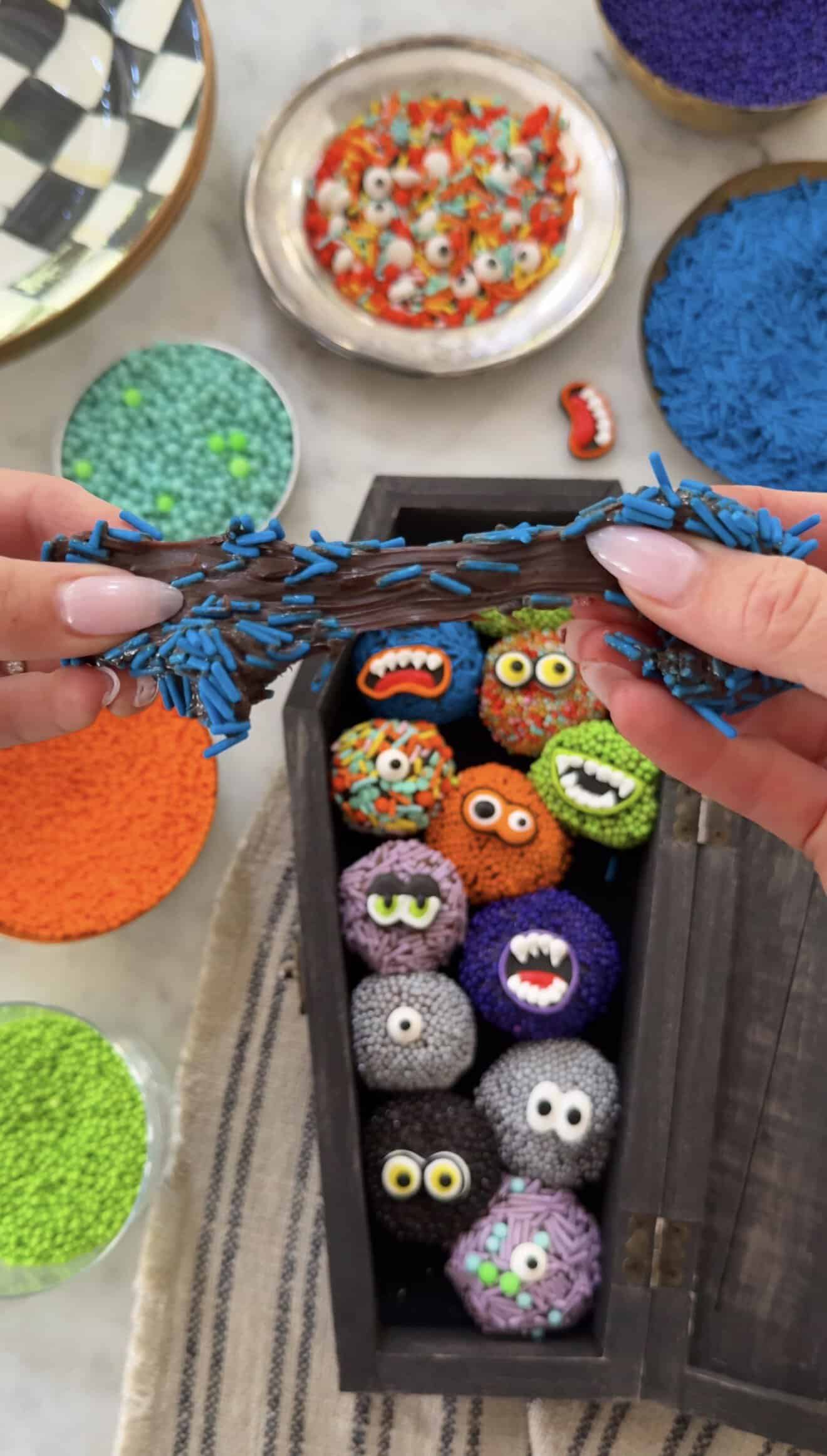 Decorative monster-themed brigadeiro candies for Halloween celebration.