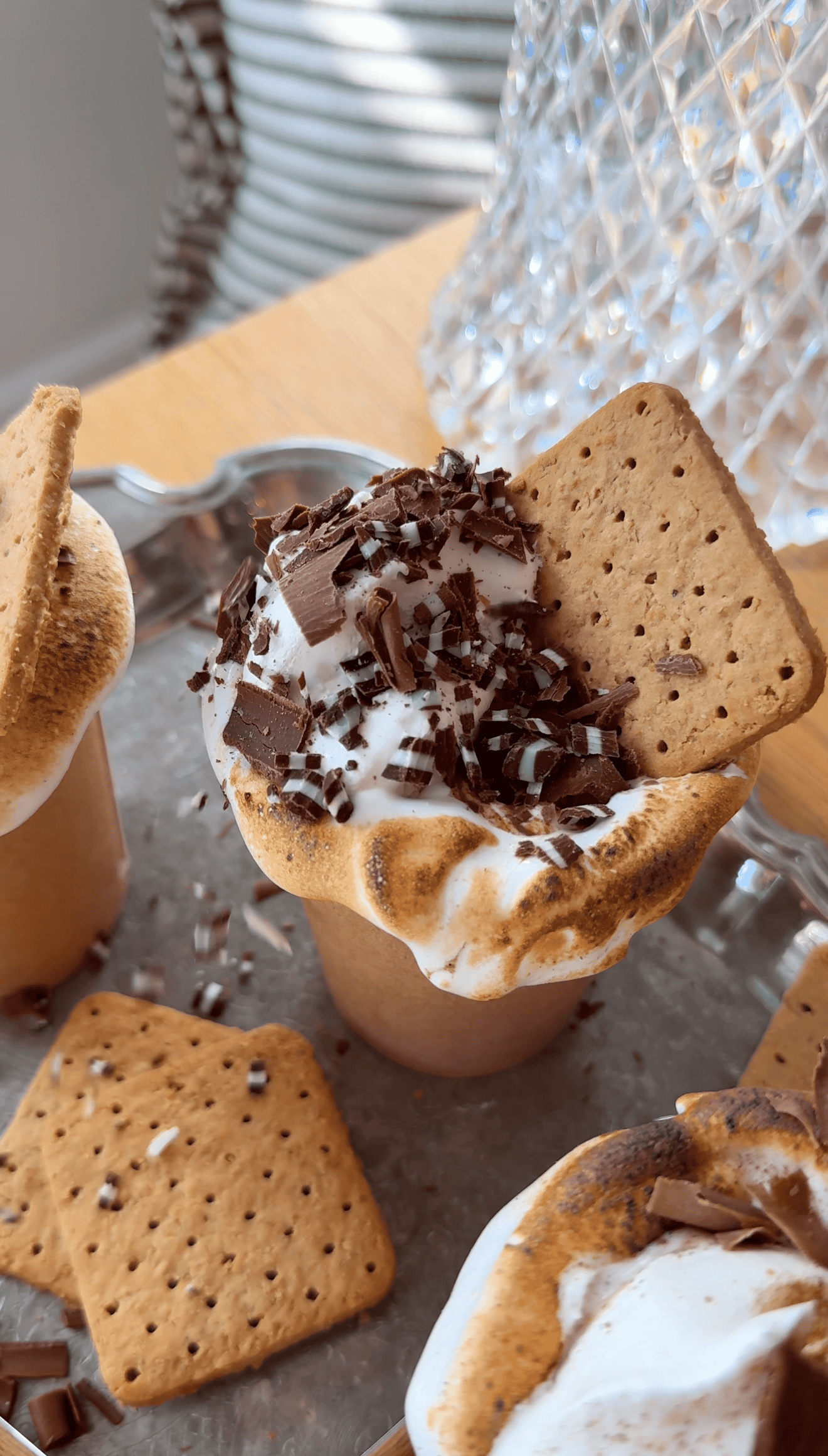 Hot cocoa with marshmallow and chocolate shavings in a marshmallow cup.
