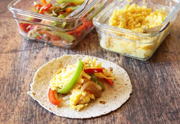Fill your tortillas. Figure 1 1/2 eggs per tortilla and then whatever else you want to put in with it.