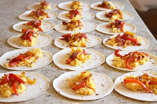 I did a bunch of these with just eggs and veggies and then a couple in the back with ham, cheese, and veggies. I also did a batch with just egg whites and scallions. Very healthy.