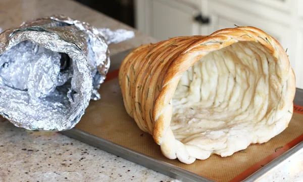Be patient and the foil will come out. I promise! The center of the cornucopia will be white. It's completely cooked it just doesn't turn golden brown.